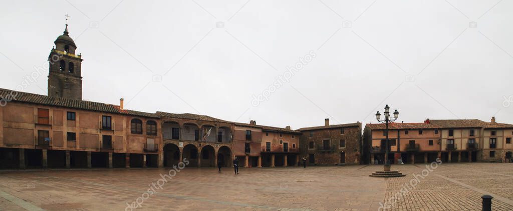 Main Square (plaza mayor) of the medieval town of Medinaceli in Soria, Spain. Historic town with a large number of monumental (old town) buildings that is now commonly visited by tourists.