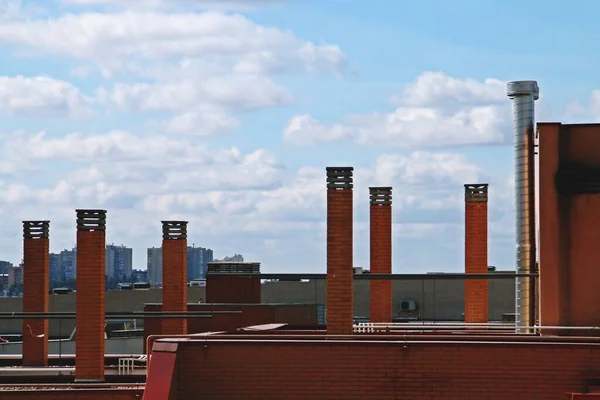 Boiler chimneys of a modern building. Equipment on the roof of a new building in Madrid, Spain (03 05 2019).