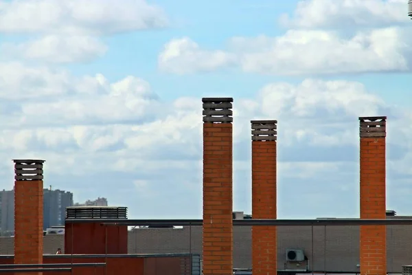Boiler chimneys of a modern building. Equipment on the roof of a new building in Madrid, Spain (03 05 2019).
