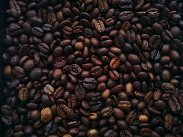 Roasted coffee beans for drinks. Coffe background. Desktop wallpaper. Web design and banners. Food topic. Caffee poster