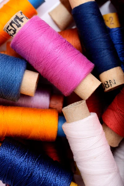 Background with multi color thread spools — Stock Photo, Image