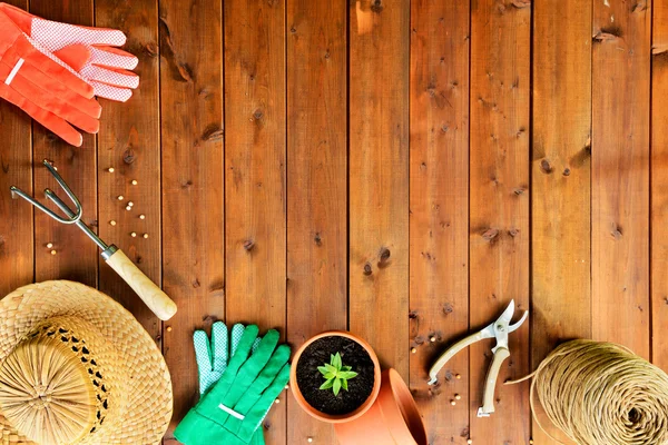 Copyspace frame with gardening tools and objects on old wooden background — Stock Photo, Image