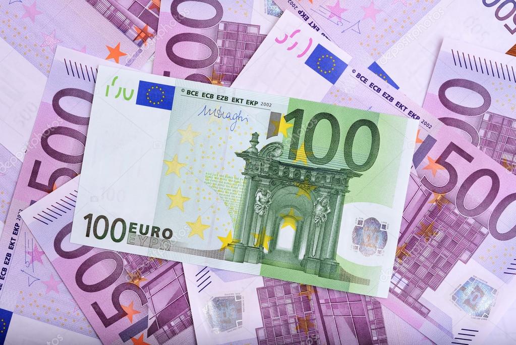 100 and 500 euro banknotes on the table