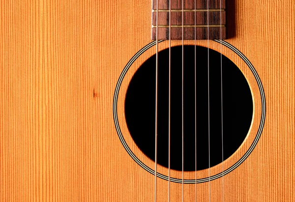 Nahaufnahme Westerngitarre auf Holzgrund — Stockfoto
