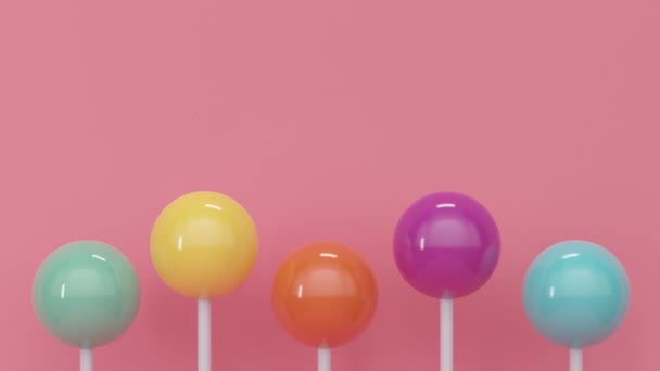 Berkilau manis lolipop berwarna dengan tongkat. Animasi loop abstrak — Stok Video