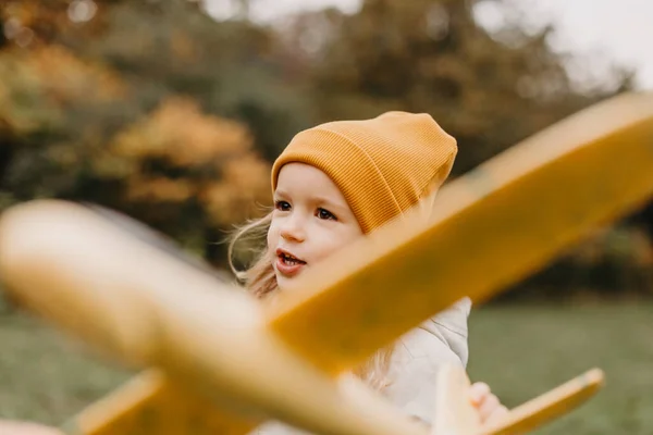 Portrait Little Cute Girl Playing Yellow Toy Airplane Autumn Park — Stock Photo, Image