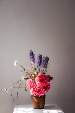 photo of a bouquet created from wild fresh spring flowers photographed on a white background in daylight, flowers for cut out white background