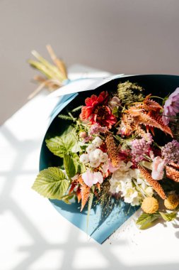 photo of a bouquet created from wild fresh spring flowers photographed on a white background in daylight, flowers for cut out white background