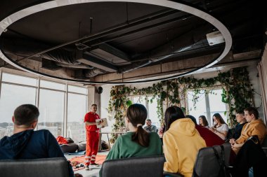 26.03.2022 Kyiv, Ukraine:  Training on emergency medical care was conducted by a Red Cross instructor in the office space for the civilian population of Ukraine due to the military attack on Russia