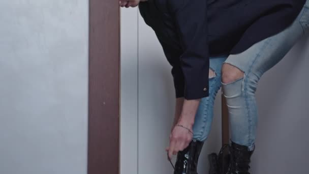 Caucasian Bald Gay Man Putting Huge Black Goth High Heels — Stockvideo