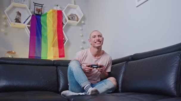 Bald Queer European Gay Activist Using Gamepad Wining Game While — Wideo stockowe