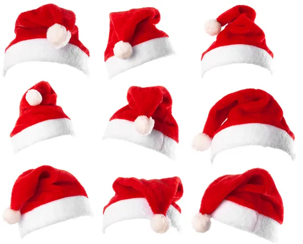 Набор из 9 красных шляп Санта-Клауса изолированы на белом фоне — стоковое фото