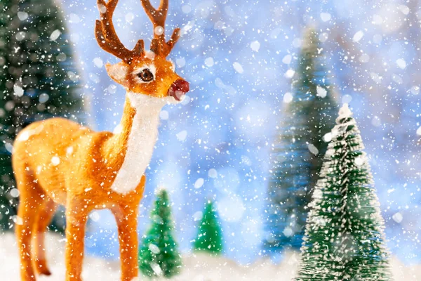 Toy deer in a snowy forest, New Year card, concept — Stock Photo, Image