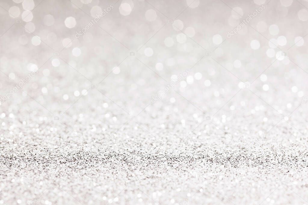 sparkles of Silver glitter abstract background. Copy space