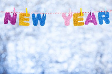 Happy new year inscription, letters on a rope, copy space
