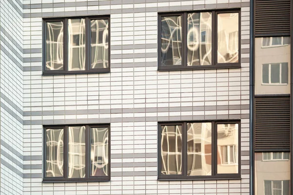 Laminated plastic windows on the facade of apartment buildings — Fotografia de Stock