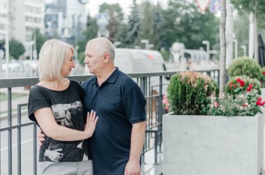 a man and a woman are hugging