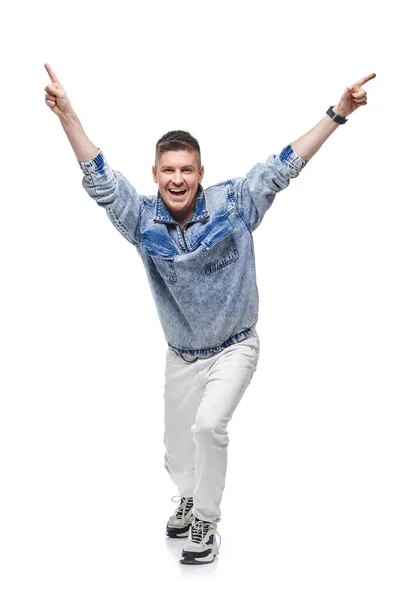 Man in denim jacket celebrating success with hands up in the air — Stock Photo, Image