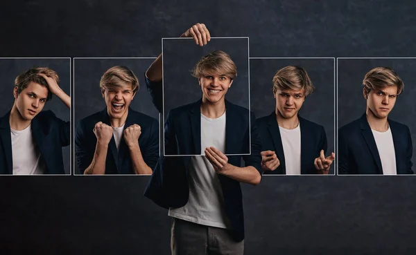 Giovane uomo che tiene ritratti viso con diverse emozioni — Foto Stock
