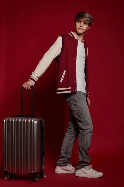 Young Excited Caucasian Man Tourist Suitcase Red Background — Stockfoto