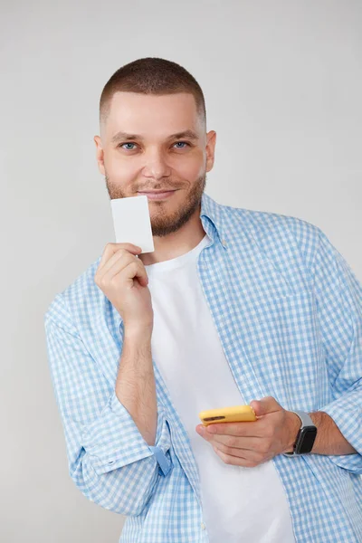 Smiling Handsome Man Mobile Cell Phone Credit Bank Card Making — Stok fotoğraf