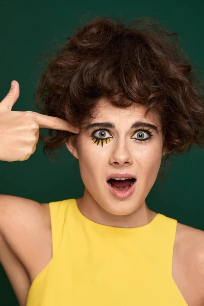 Young Curly Woman Creative Make Pointing Hand Fingers Head Gun — Stockfoto