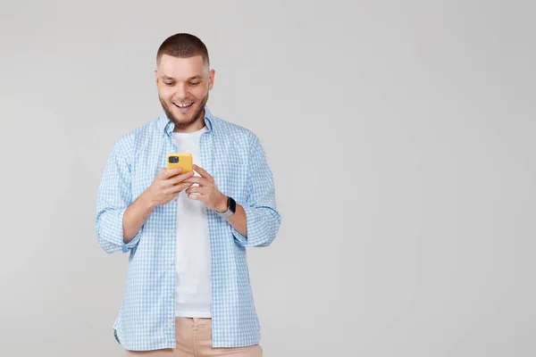 Happy Handsome Bearded Man Blue Shirt Messaging Mobile Cell Phone — Fotografia de Stock