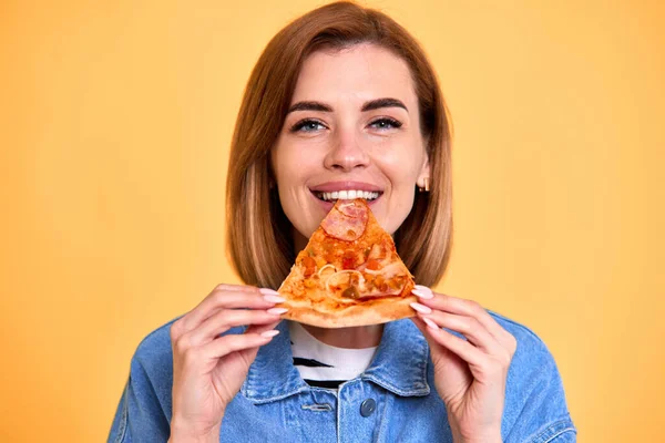 Excited Beautiful Woman Eating Satisfation Pizza Slice Yellow Background — Foto de Stock