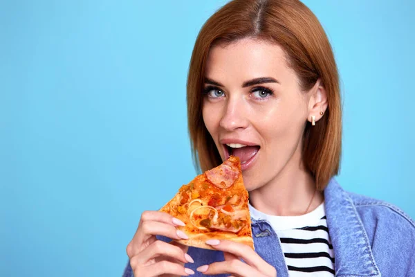Young Woman Eating Pizza Slice Looking Delighted Blue Background Copy — Foto de Stock