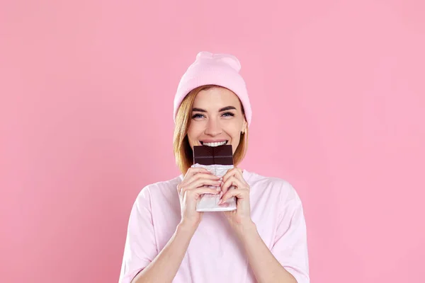 Beautiful Young Woman Casual Shirt Biting Delicious Chocolate Bar Looking — Foto de Stock