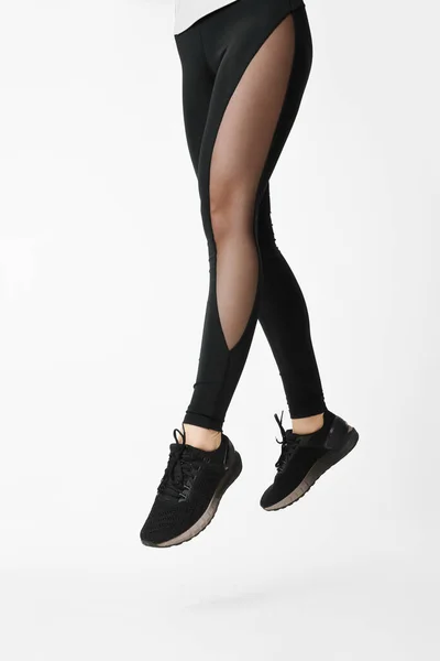 Slim Female Legs Black Sport Leggings Running Shoes Jumping White — Fotografia de Stock