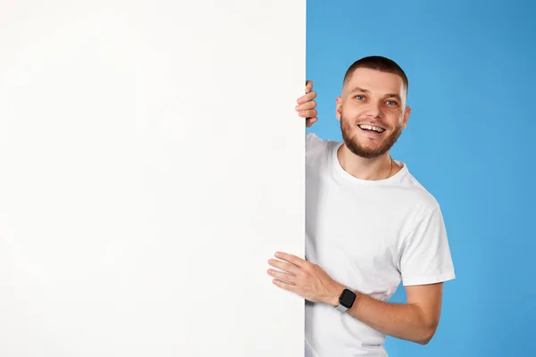 Portrait Cheerful Bearded Man Standing White Empty Advertising Board Isolated — Photo