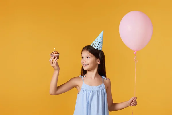 Happy Little Girl Party Cone Holding Cupcake Pink Balloon Her — Stockfoto