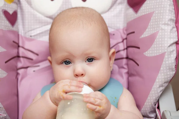 Adorable Baby Months Old Sits Drinks Milk Bottle Baby Chair — Stock Photo, Image