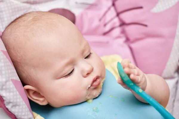 Cute Baby Girl Eating Spoon Baby Chair Kitchen — Foto Stock