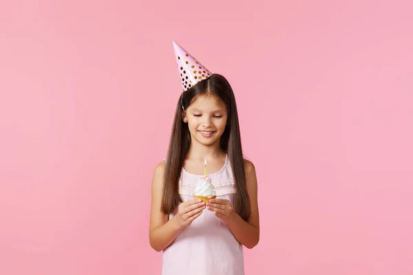 Happy Little Birthday Girl Party Cone Holding Cupcake Pink Background — 스톡 사진