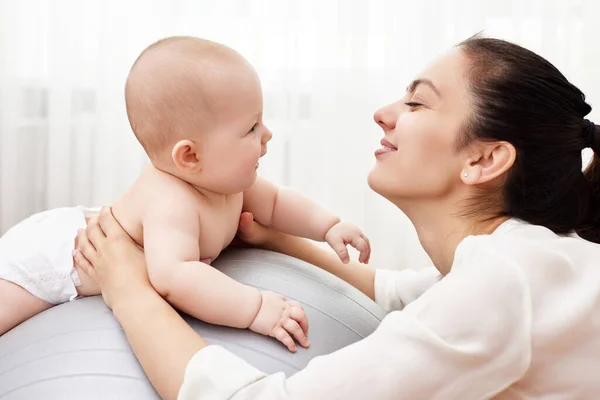 Happy Mother Playing Her Baby Girl Fitness Ball Home — Stock Photo, Image