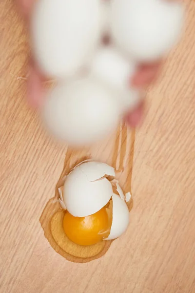 broken egg on the floor in kitchen, top view