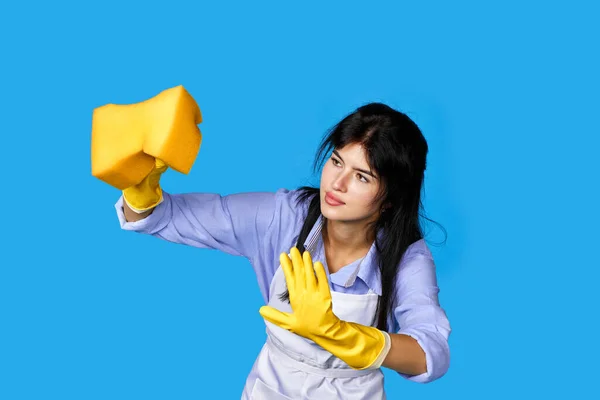 Young Attentive Woman Rubber Gloves Cleaner Apron Cleaning Yellow Sponge — Stock Photo, Image