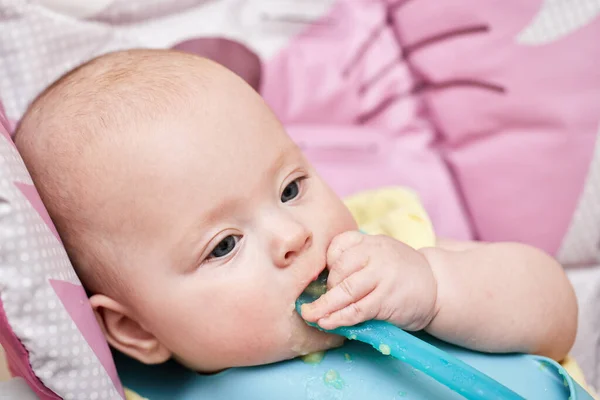 Cute Baby Girl Eating Spoon Baby Chair Kitchen — Stock Photo, Image