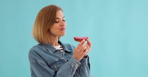 Smiling Beautiful Blonde Woman Biting Donuts Blue Background Copy Space — Stock Video