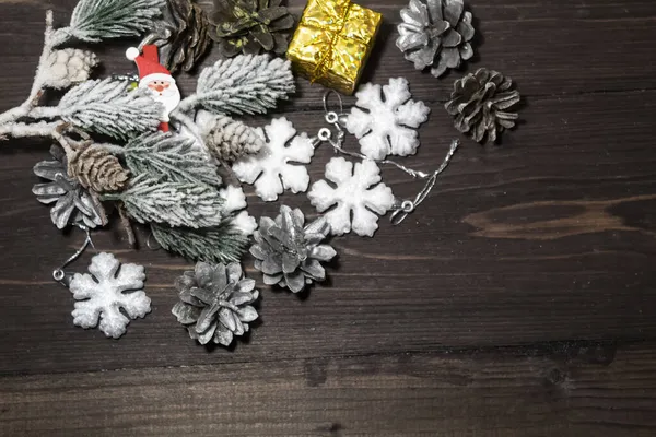 Dark Wooden Background Lie Snowflakes Snow Covered Spruce Branch Silver — Stock Photo, Image