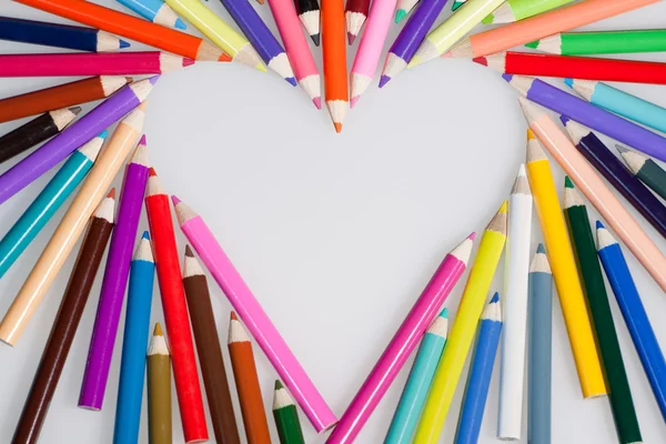 Colored pencils heart shape — Stock Photo, Image