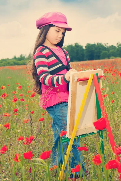 Vintage little girl on the poppy meadow — Stock Photo, Image