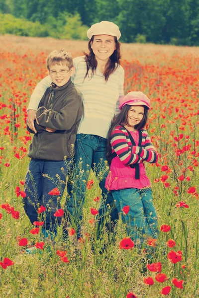 Vintage family on the poppy meadow — Stock Photo, Image