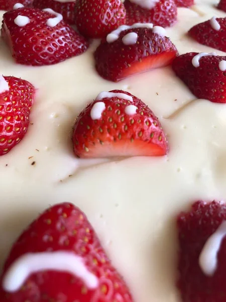 selective focus. Strawberry pie garnished with fresh strawberries. Homemade strawberries cake made from meringue cake and cream with strawberries. Decorated with icing and berries. birthday cake with smiley face.