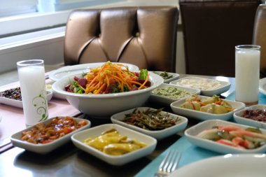 Traditional Turkish meze and appetizers on dinner table. Mazzeh, Meze, Mezze, or Mazza is a selection of small dishes served as appetizers in much of West Asia and the Balkans. 