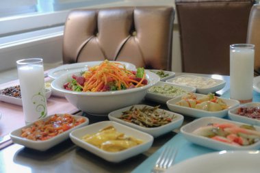 Traditional Turkish meze and appetizers on dinner table. Mazzeh, Meze, Mezze, or Mazza is a selection of small dishes served as appetizers in much of West Asia and the Balkans. 