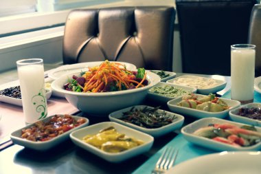 Traditional Turkish meze and appetizers on dinner table. Mazzeh, Meze, Mezze, or Mazza is a selection of small dishes served as appetizers in much of West Asia and the Balkans. 