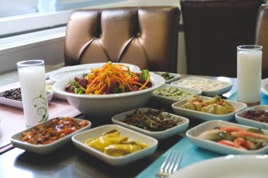 Traditional Turkish meze and appetizers on dinner table. Mazzeh, Meze, Mezze, or Mazza is a selection of small dishes served as appetizers in much of West Asia and the Balkans. 